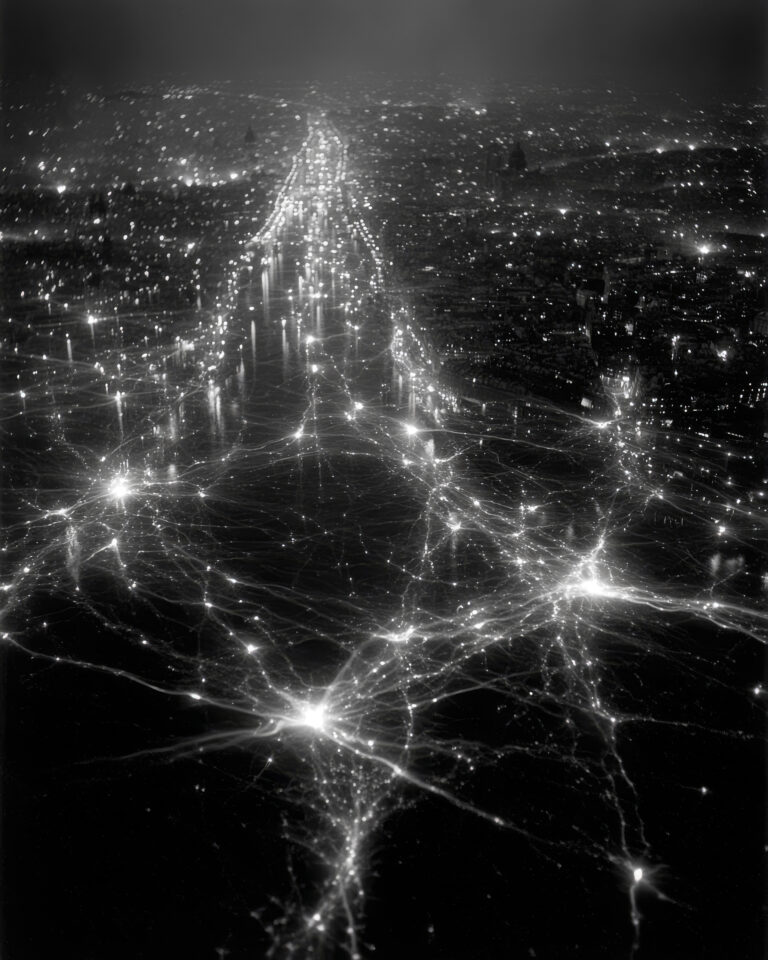 Aerial black and white photograph of a city at night where illuminated streets and intersections merge with luminous synaptic connections and neural network nodes, suggesting a regulated system of data flow.